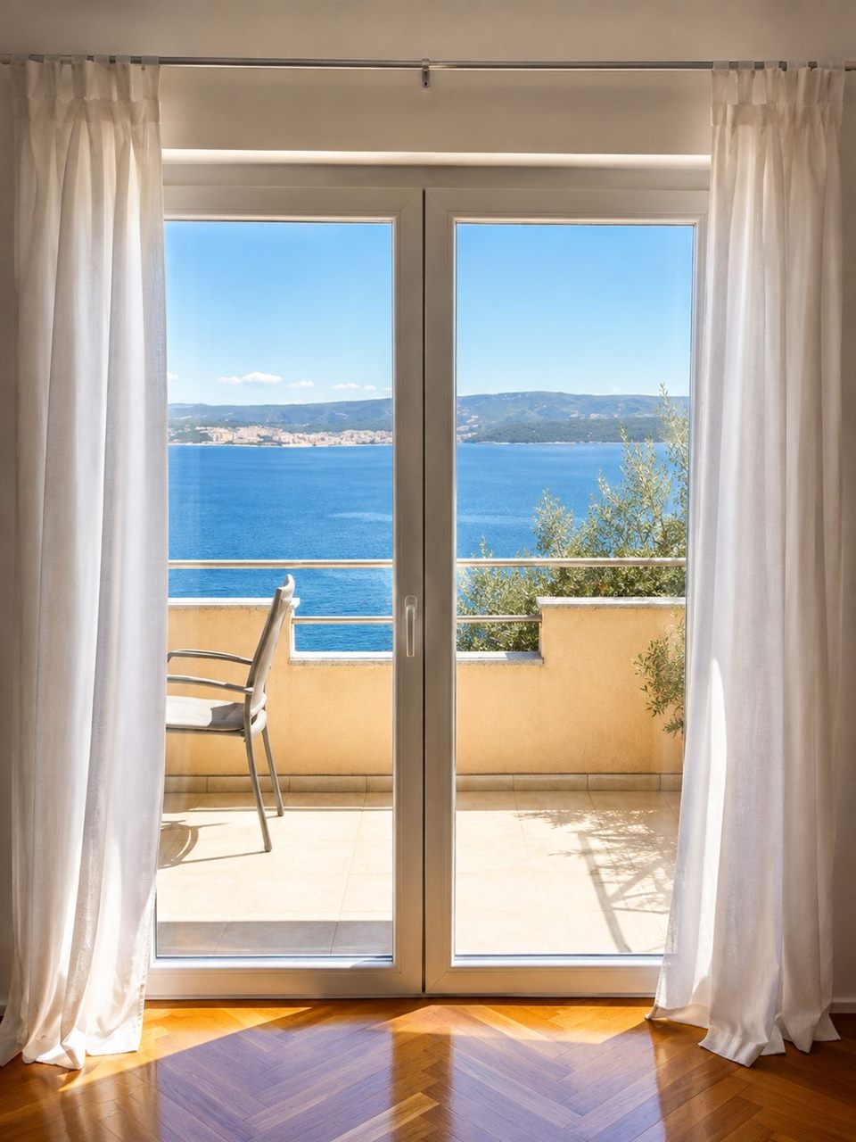 Balcony doors opening onto the terrace with sea view