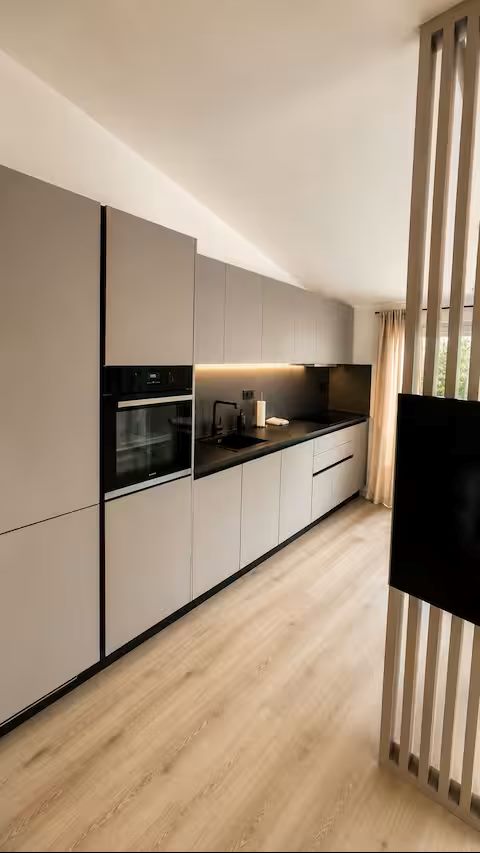 Modern fitted kitchen with built-in appliances