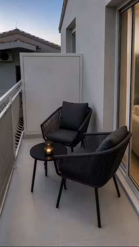 Balcony with two armchairs